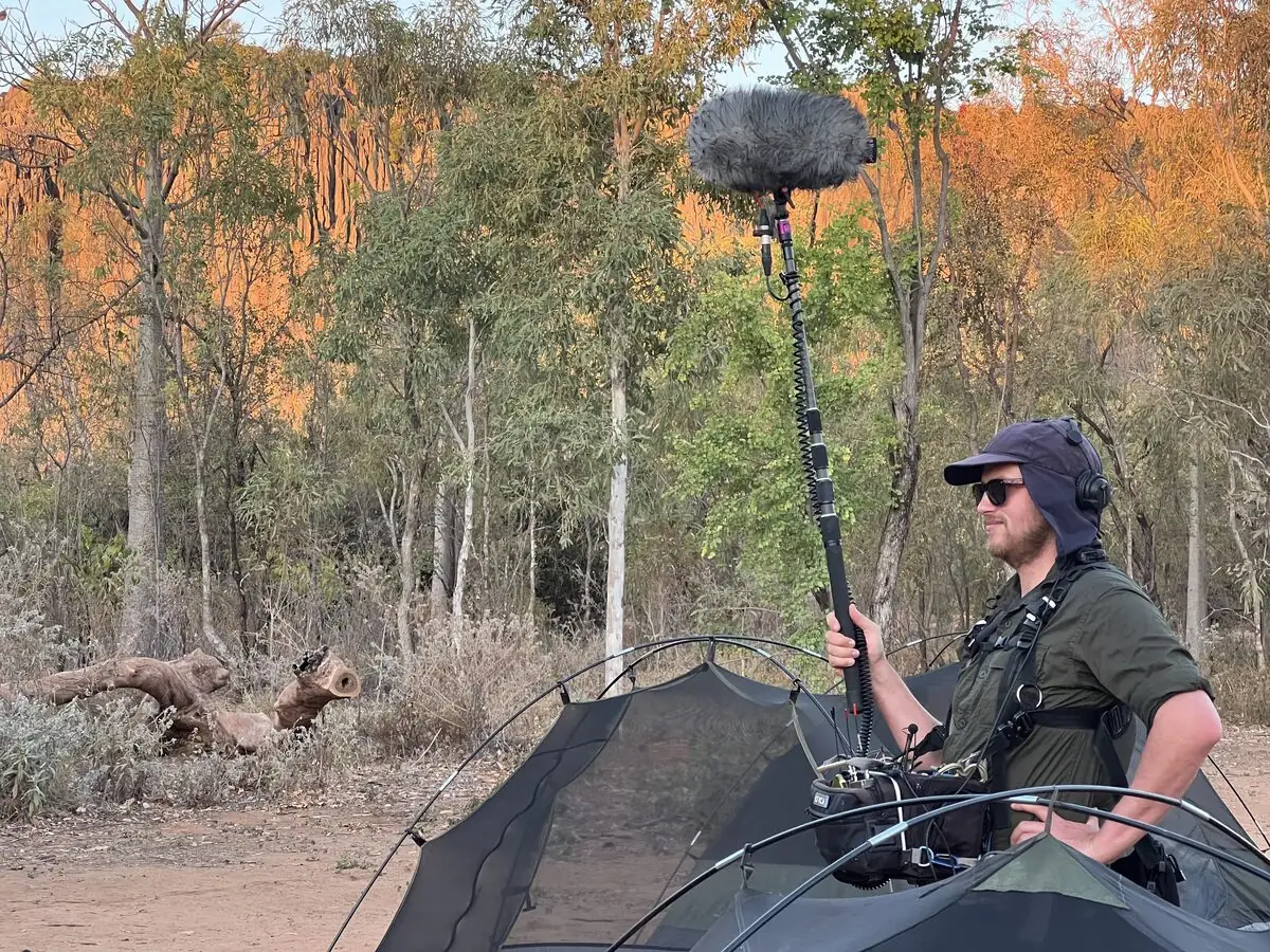Perth-based WA location sound recordist Richard Hubbard operating a boom microphone in the Australian outback