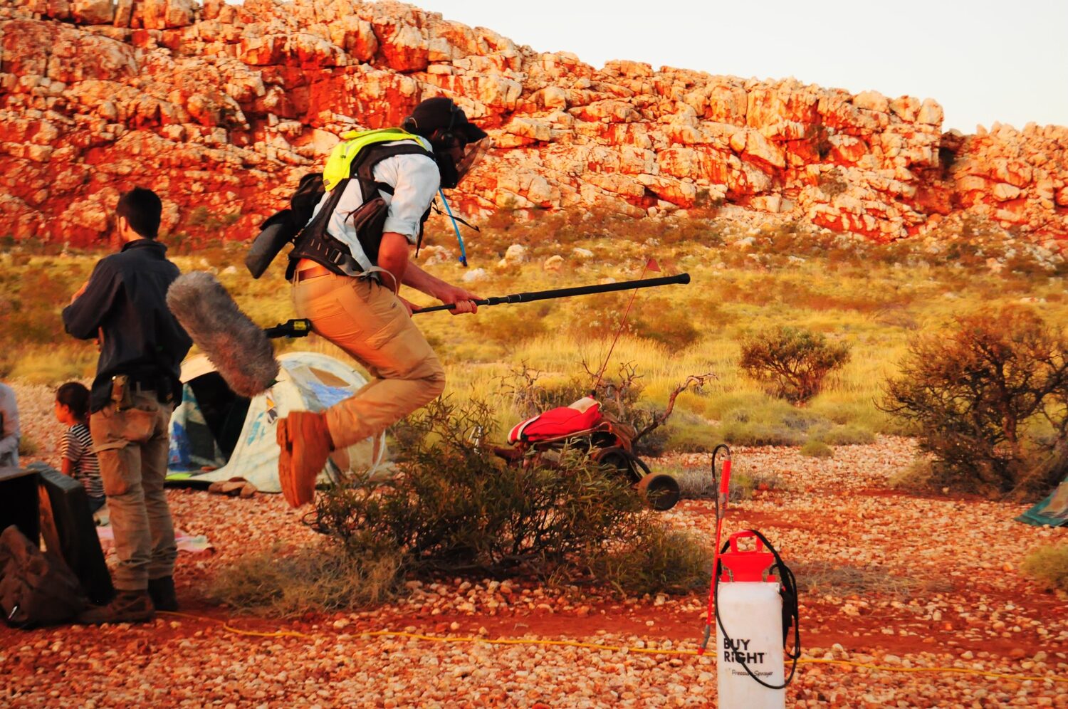 Sound recordist leaping across the outback to keep the boom in position